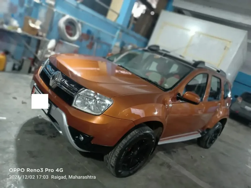 Front quarter view of an SUV being repaired at the Grand Automotive workshop in Panvel