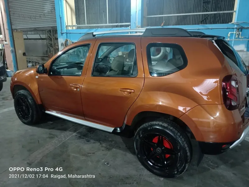 Side profile of a repaired SUV at the Grand Automotive bodyshop in Panvel