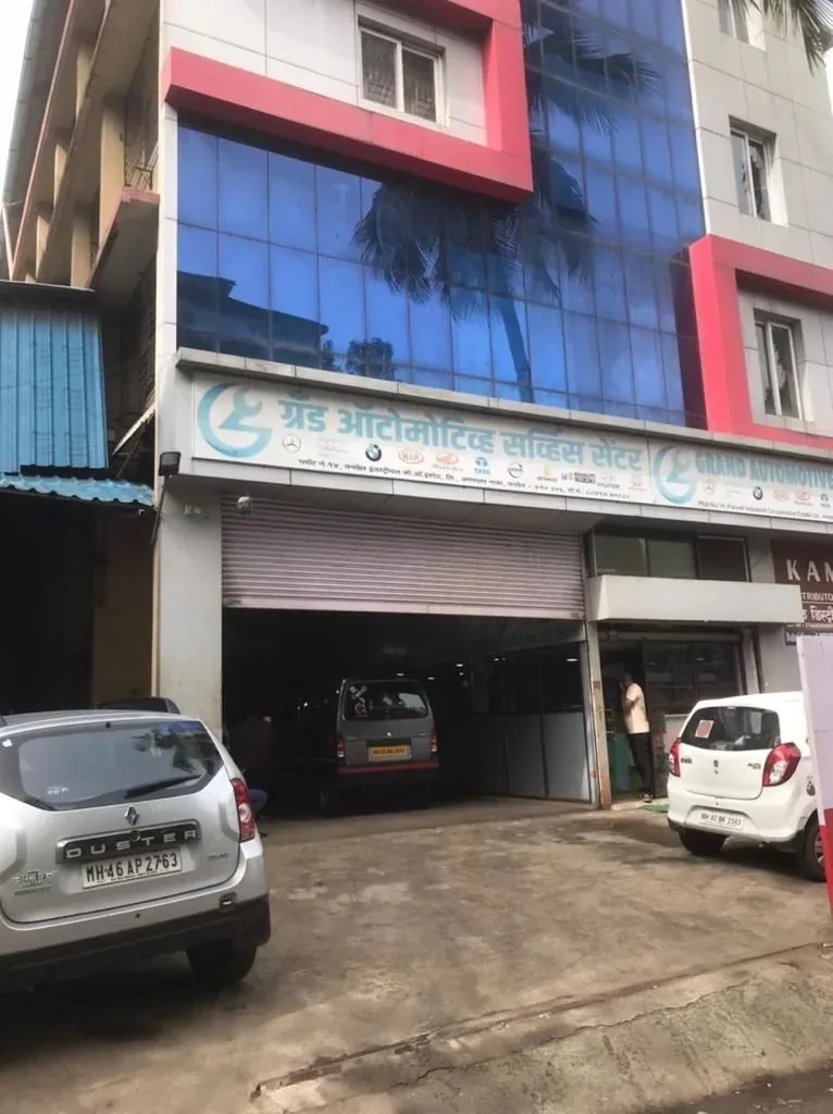 Street frontage of the Grand Automotive Service Centre workshop at Amardham Naka, Panvel